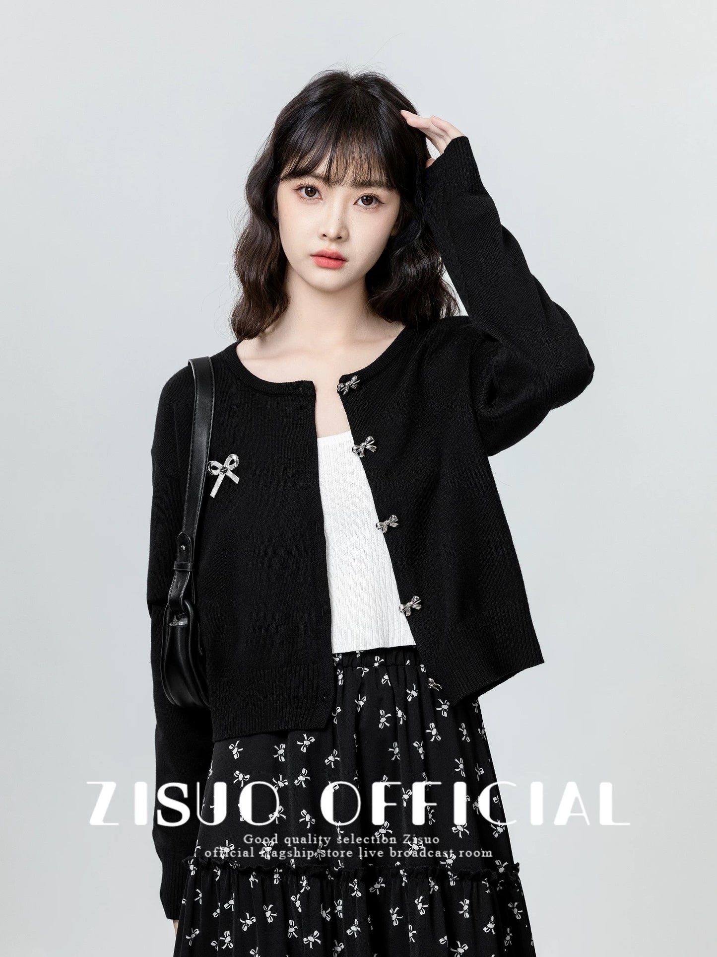 Women's black knitted cardigan, spring and autumn 2026 new style, niche design, slimming sweater, short top.