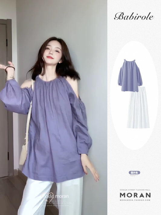 Korean chic early spring style outfit, a complete set of off-shoulder halterneck lazy tops, casual long-sleeved 2025 new styles for women