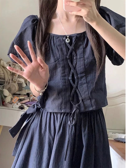 A complete set of outfits for little people who are popular on the street. Women's summer puff sleeve top, denim skirt, sweet and spicy two-piece suit.
