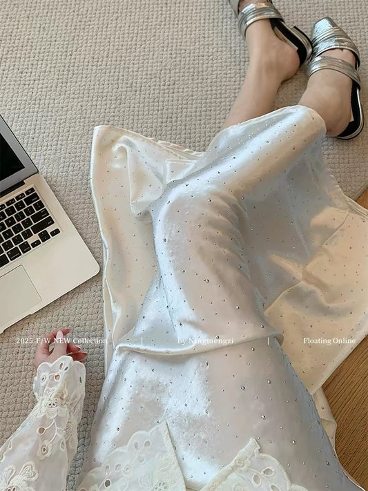 French-style white rhinestone acetate satin midi skirt, new 2025 style, gentle and flowing, modern Chinese fishtail skirt.