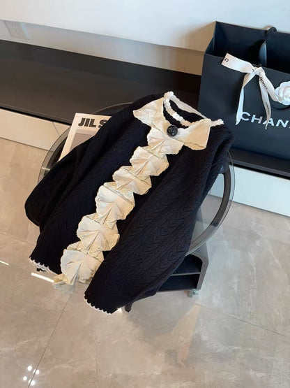 July Launch: Miu-inspired "heiress aesthetic" — black long-sleeve knit cardigan featuring intricate embroidery and a detachable bow.