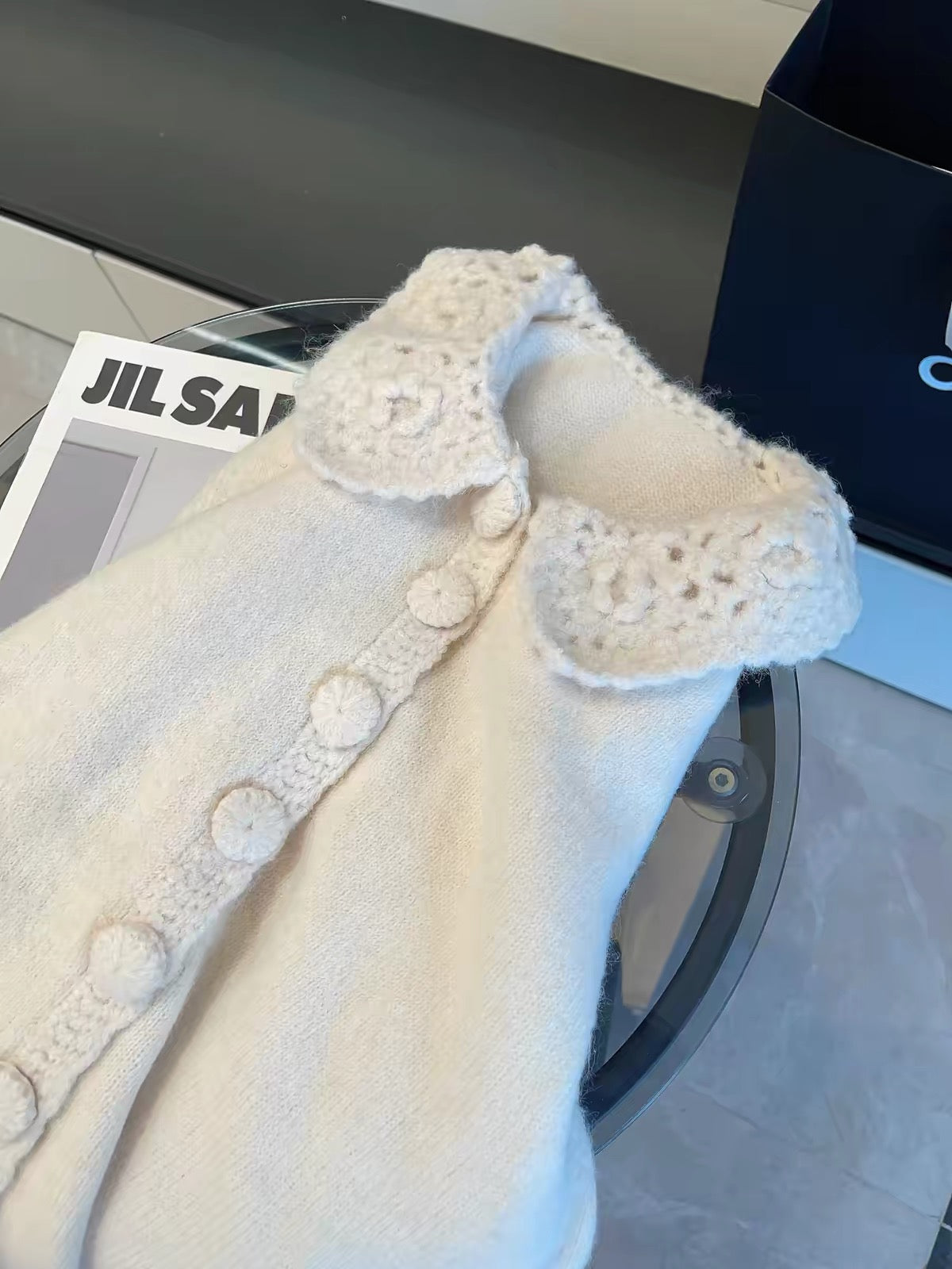 JULY START: Soft,-inspired style—vintage-style handmade crochet-paneled knit cardigan with a Peter Pan collar and single-breasted button closure.