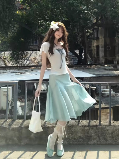 French-style gentle vacation fresh mint green two-piece women's set 2026 new summer off-shoulder short-sleeved slimming suit