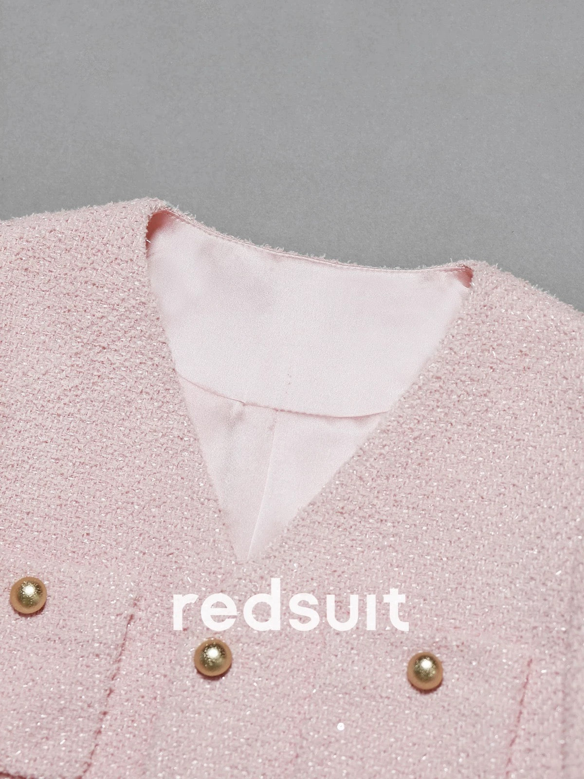 Redsuit, a sweet and youthful tweed jacket with four pockets and gold buttons, featuring a Chanel-inspired design and a sweet and elegant style.