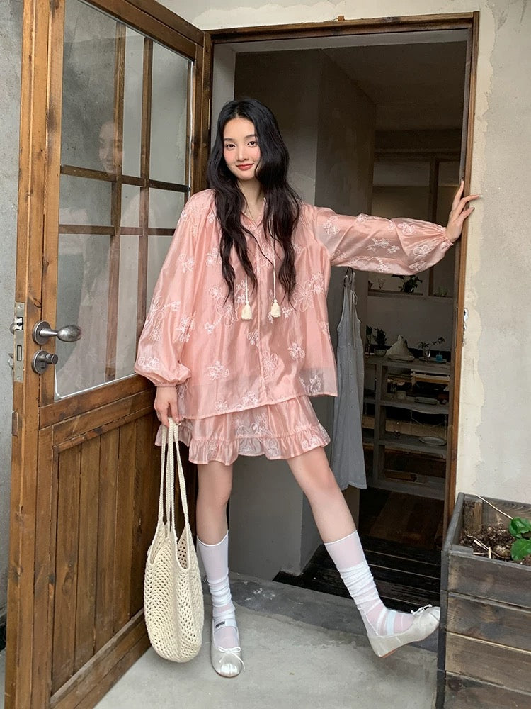 Find a sophisticated two-piece set for women, featuring a sheer, shimmering shirt and skirt in a modern Chinese style, perfect for spring.