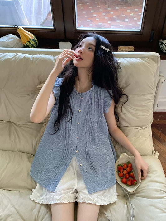 Find the perfect blue sleeveless shirt with ruffled trim for women, a stunning new summer 2026 design, featuring a unique and stylish cut.