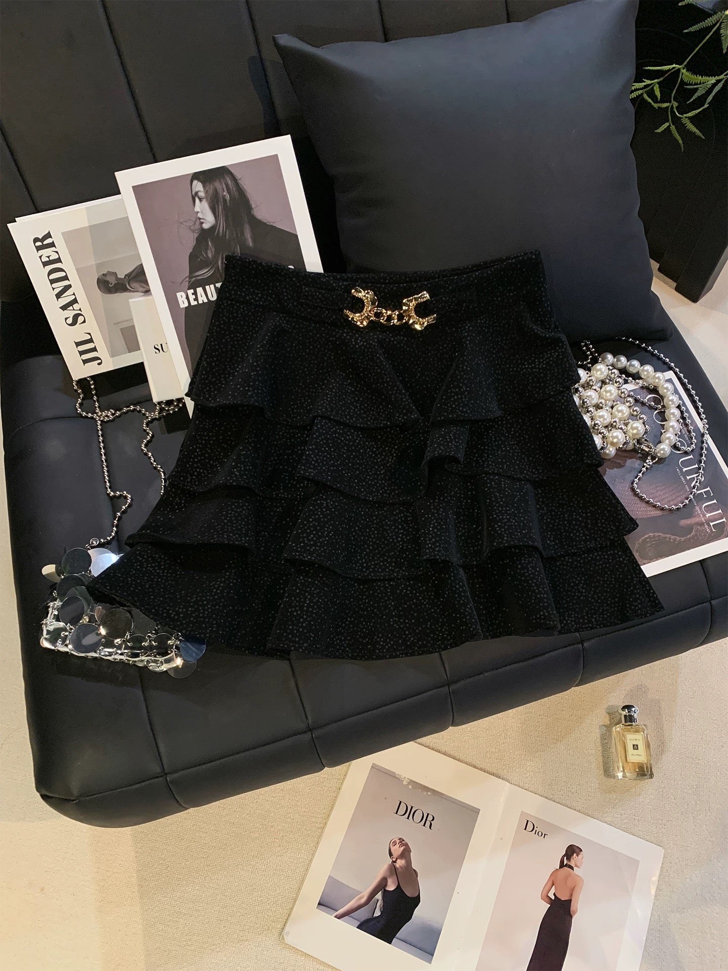 ZHOUYI/Monday: A stylish polka dot PU leather mini skirt with metal buckle, perfect for autumn and winter. It's a high-waisted skirt that flatters the figure.