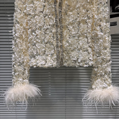 Popular online style, 2025 winter new light luxury elegant ostrich feather sleeve sequined cotton-padded short jacket top for women.