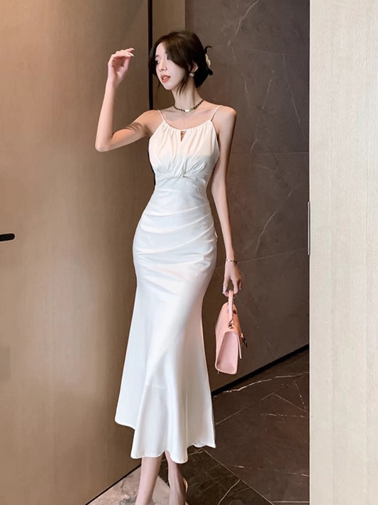 White fishtail hip-wrapped halter neck suspender dress for women in summer with waist-tightening temperament, super fairy lady, high-end long skirt