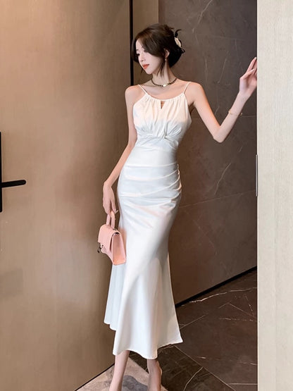 White fishtail hip-wrapped halter neck suspender dress for women in summer with waist-tightening temperament, super fairy lady, high-end long skirt