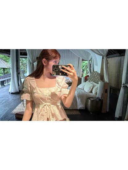 CHICYOU "m1u Pure Style" White Short-Sleeve Blouse with Cut-Out Embroidery, Ruffled Collar, and Waist Belt