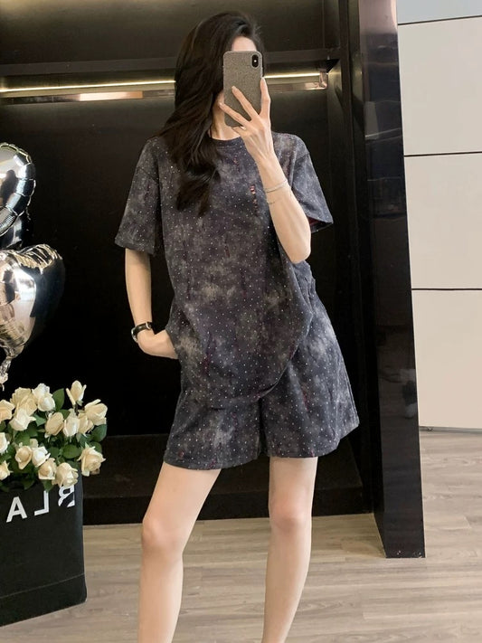 Fashionable and stylish sports suit for women in summer 2025 with rhinestone ripped short sleeves and shorts, two-piece suit, loose and casual
