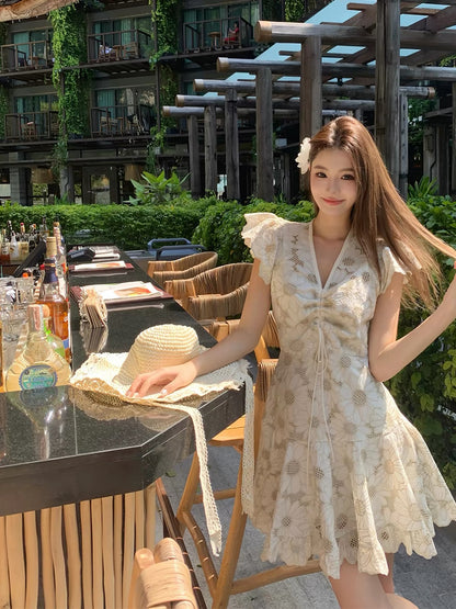 ORG Holiday Collection: French-style sweet beige floral dress featuring short sleeves, cut-out floral detailing, and a high-waisted design