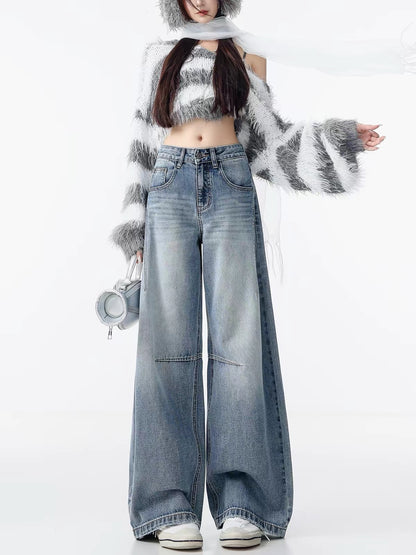 ABWLR Sea Salt Soda – Original vintage-style, distressed light-blue wide-leg jeans featuring exposed stitching and a floor-length cut.