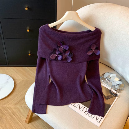 A must-have! This long-sleeved knit top with beaded 3D floral details is a sweet and spicy off-shoulder style perfect for autumn.