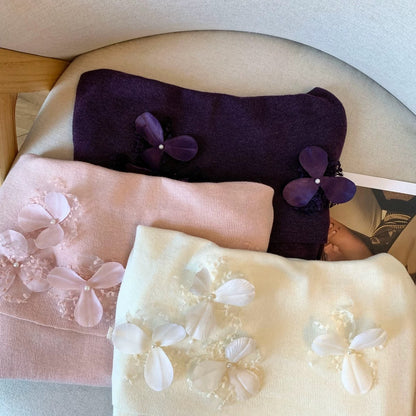 A must-have! This long-sleeved knit top with beaded 3D floral details is a sweet and spicy off-shoulder style perfect for autumn.