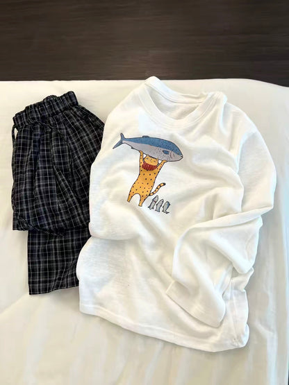 Korean-style casual long-sleeved pajama set for women—featuring a cartoon print top and loose plaid trousers; suitable for loungewear or casual wear; available in plus sizes.