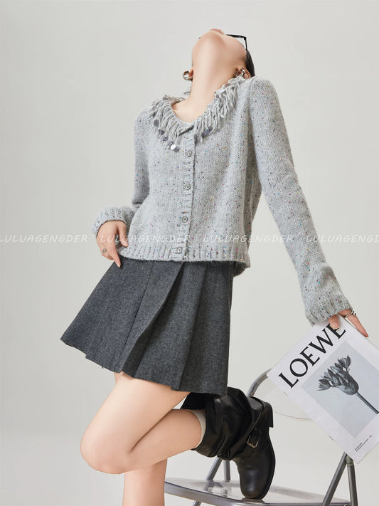 Lulu's style winter sweater with a vintage feel, featuring colorful sequins—super pretty and versatile for work.