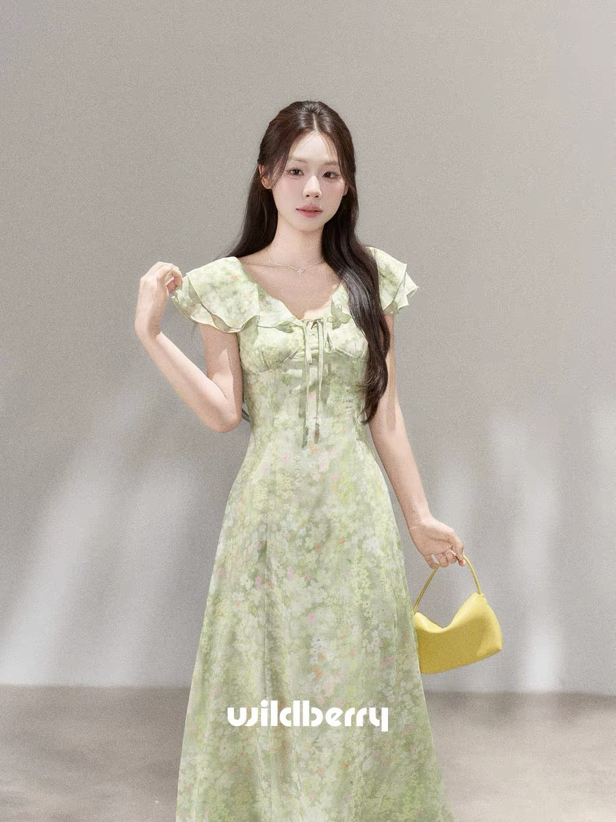 A beautiful French-style long dress with a small wild berry green floral print, a new summer 2026 style.