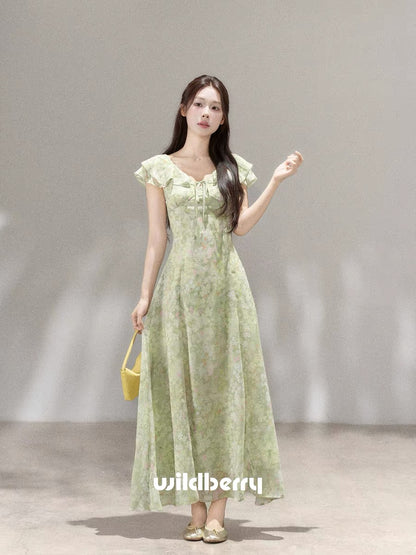 A beautiful French-style long dress with a small wild berry green floral print, a new summer 2026 style.