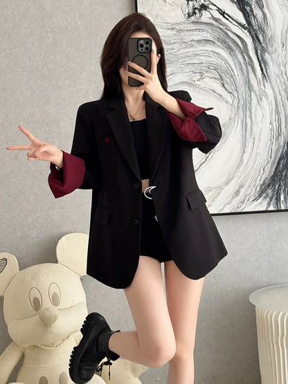 Autumn's sophisticated and versatile black blazer for women, exuding elegance, professional style, and a relaxed, casual fit.
