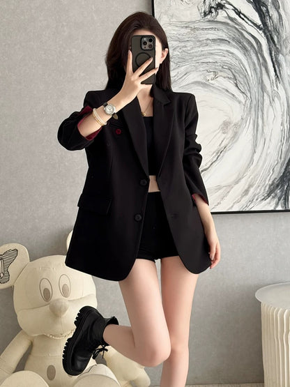 Autumn's sophisticated and versatile black blazer for women, exuding elegance, professional style, and a relaxed, casual fit.