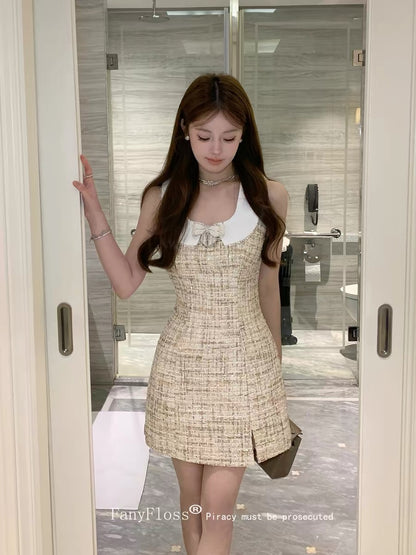 FanyFloss, a wealthy heiress-style dress with a bow and rhinestone embellishments, featuring a fitted waist, a doll collar, and beaded bodycon skirt.