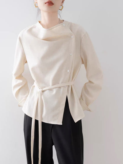 Women's French-style vintage asymmetrical blouse (New for Autumn 2026): an elegant, off-white, waist-cinching shirt featuring a draped neckline.