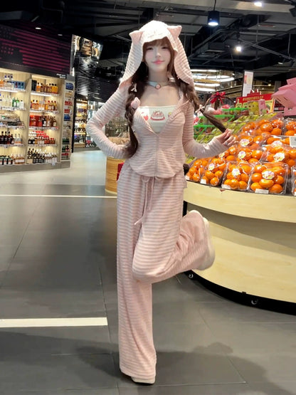 A sweet and spicy two-piece set in pink, featuring a fitted sweatshirt, cardigan, and wide-leg pants, perfect for early autumn and a sporty look.