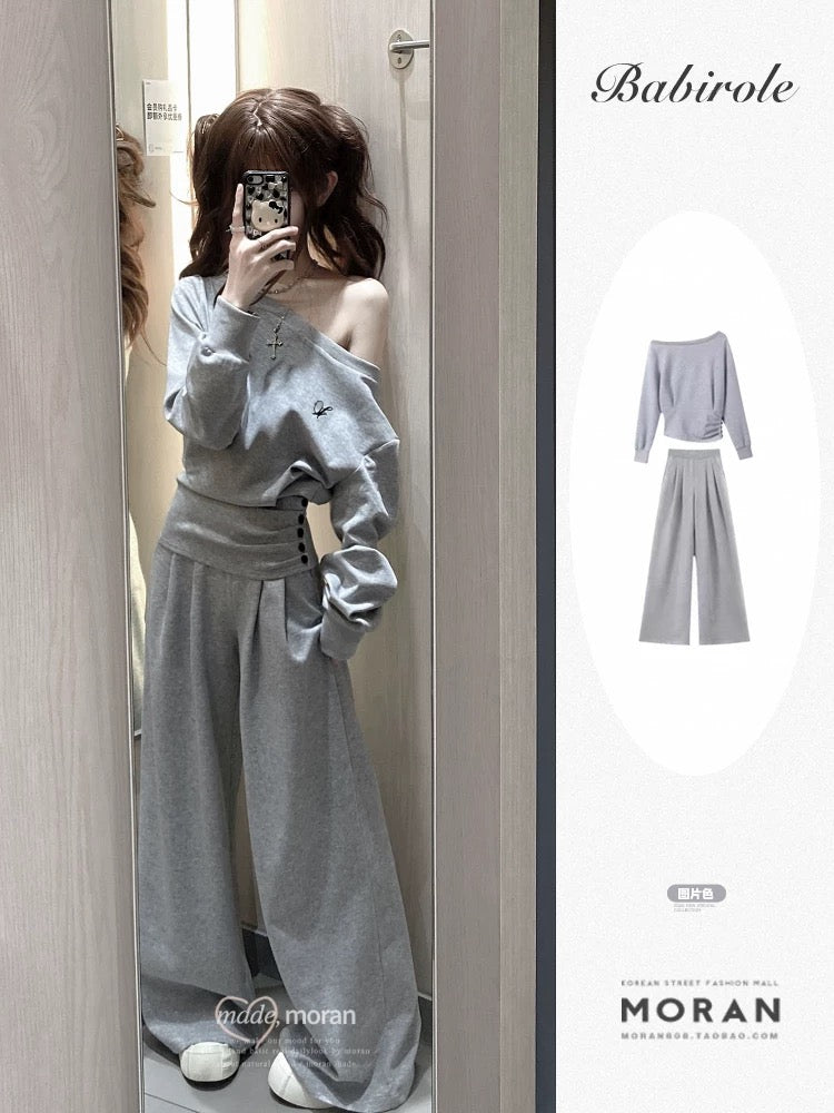 A casual, relaxed style two-piece set of gray off-shoulder fitted sweatshirt and wide-leg pants for women, perfect for petite women in autumn and winter.