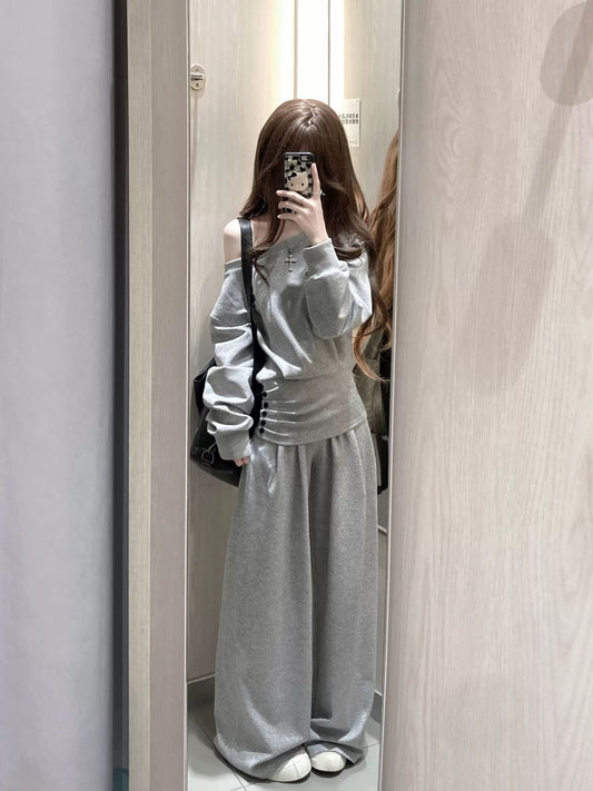 A casual, relaxed style two-piece set of gray off-shoulder fitted sweatshirt and wide-leg pants for women, perfect for petite women in autumn and winter.