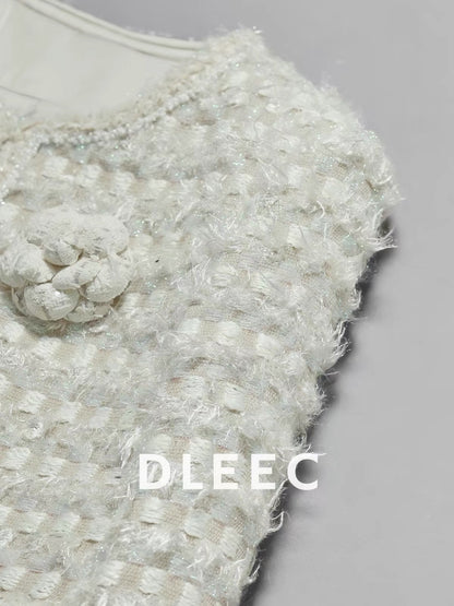 DLEEC – Unique and distinctive! A "-style" jacket in a creamy apricot hue, featuring a textured, iridescent plaid pattern.