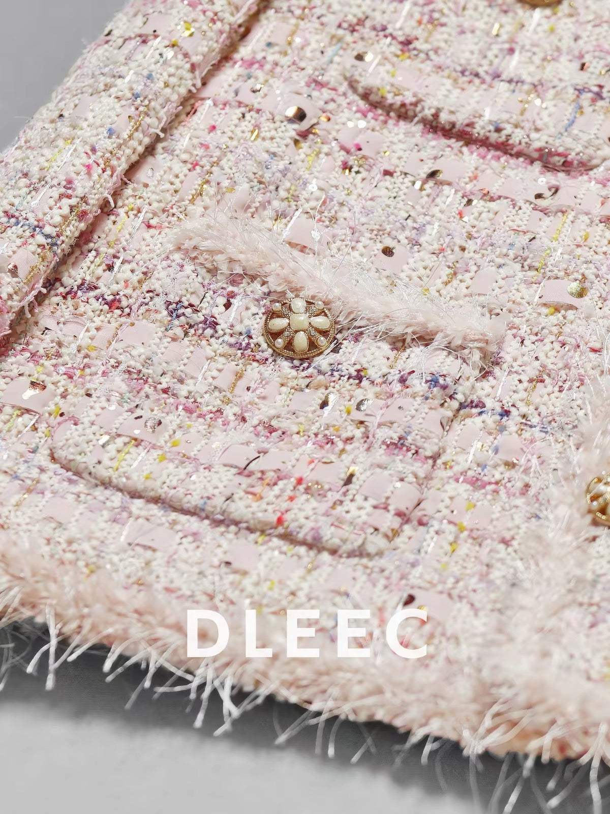 DLEEC Romantic Vibe – Pink Tweed "-Style" Jacket: A Youthful, Sophisticated Piece Featuring Intricate Craftsmanship, Sequins, and Fancy Textured Yarn.