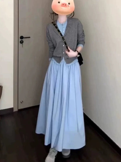Korean-style early autumn outfit: a gray two-piece knitted cardigan, top, and skirt set for women, exuding elegance and youthful charm.