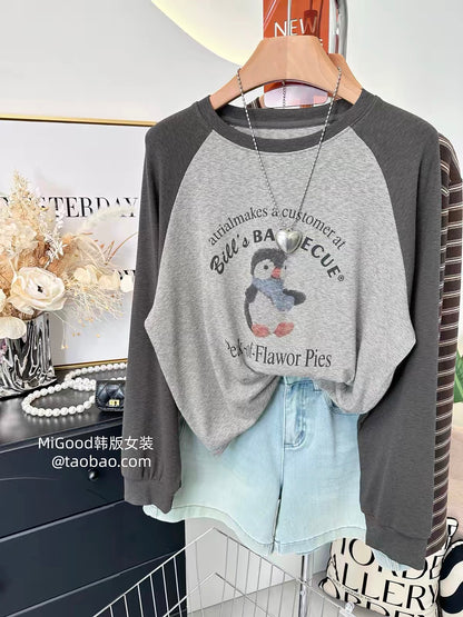 Autumn 2026 New Korean-Style Cartoon Penguin Print Long-Sleeve T-Shirt for Women – Versatile, Casual, Stretchy Raglan-Sleeve Top