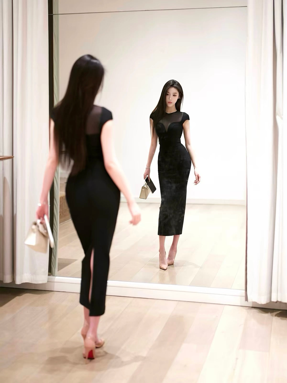 YUANZI "Black Iris" – Black bodycon maxi dress featuring spliced mesh panels and integrated strap detailing.
