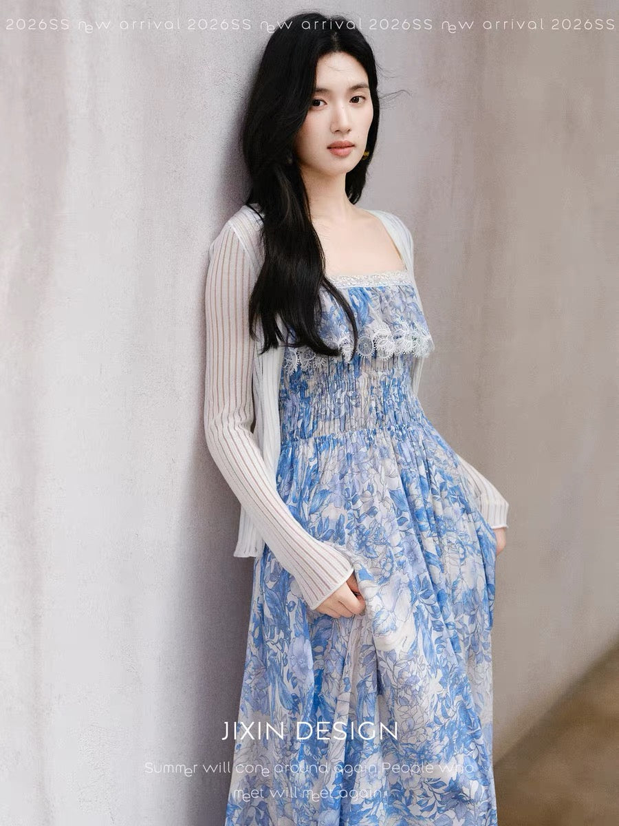 Send a letter featuring a gentle, blue and white floral print sundress with a cinched waist, a flattering and slimming Tencel linen dress.