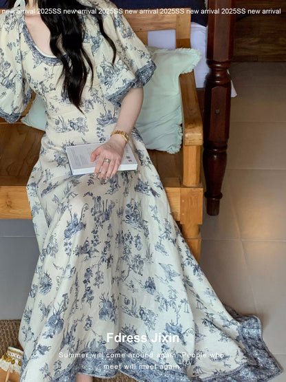 Send a letter to the "Plain Green Grass" vacation-style blue and white botanical print V-neck irregular cotton and linen dress