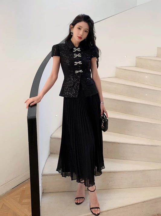 2025 new women's clothing high-end temperament commuting black woolen stitching fake two-piece dress slim long skirt