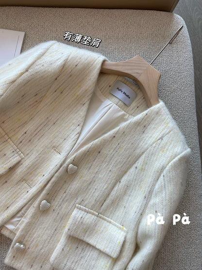 Exquisite and luxurious wool knit cardigan with heart-shaped buttons and detachable ruffled sleeves, featuring a V-neck design.