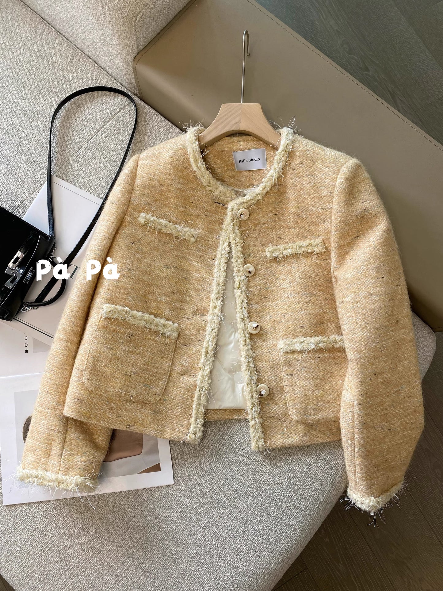 Women's winter short wool tweed coat with sequined trim and a down lining.