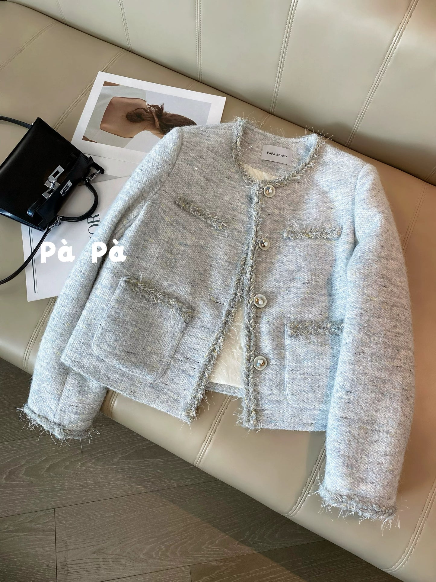 Women's winter short wool tweed coat with sequined trim and a down lining.