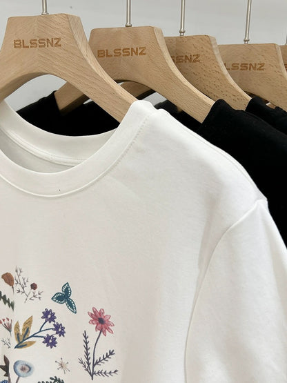 White round neck, right shoulder, short-sleeved t-shirt for women 2024 new summer design, loose and stylish printed tops and T-shirts