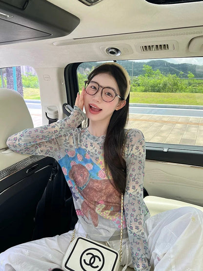 Graffiti puppy print mesh long-sleeved T-shirt for women in autumn, new design, slightly transparent, age-reducing sunscreen top