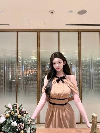 kubiliv [Pre-loved] Sleeveless color-block dress featuring a mock neck, halter-style bow, pleated detailing, and a fitted waist.