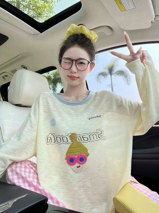 Light yellow long-sleeved T-shirt for women, new Korean design, cartoon embroidery, round neck, loose casual, slightly transparent sunscreen shirt