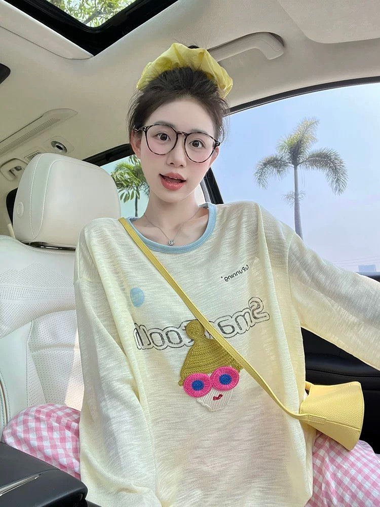 Light yellow long-sleeved T-shirt for women, new Korean design, cartoon embroidery, round neck, loose casual, slightly transparent sunscreen shirt