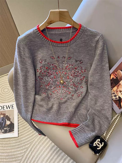 Heavy-duty butterfly and heart embroidered knit sweater for women, autumn and winter 2025 new style, white soft and smooth color-blocked round neck top.