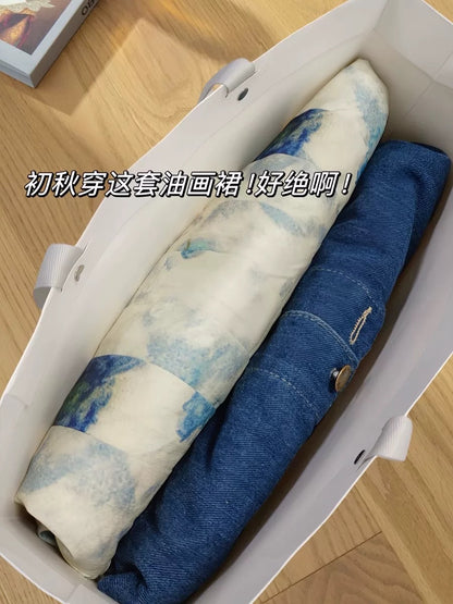 Wear a denim jacket and suspender skirt suit in early spring. Large size high-end sleeveless oil painting vest dress