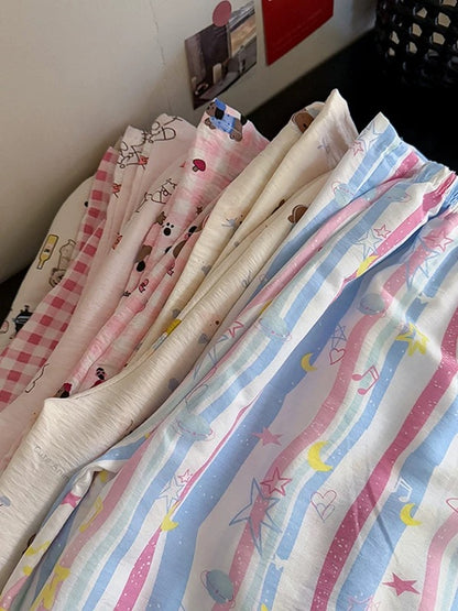 Age-reducing cartoon floral casual pants 2025 spring and summer new Korean women's clothing Western-style pajamas versatile wide-leg trousers trend